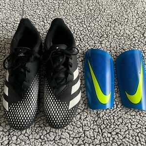Men’s size 10 soccer cleats and Nike shin guards.